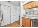 Galley kitchen with stainless steel dishwasher and plenty of storage at 3205 W De Leon St # F, Tampa, FL 33609