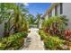 Inviting walkway surrounded by lush greenery, showcasing a clear path to modern apartments at 3205 W De Leon St # F, Tampa, FL 33609
