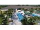 Community aerial view highlighting the pools, lounging areas, and lush greenery for relaxing and recreation at 32523 Neroli St, Wesley Chapel, FL 33543