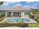 Stunning backyard with a private pool, spa, outdoor seating area, and meticulously maintained landscaping at 32523 Neroli St, Wesley Chapel, FL 33543