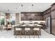 Modern kitchen with stainless steel appliances, center island with seating, and stylish pendant lighting at 32523 Neroli St, Wesley Chapel, FL 33543