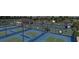 Overhead view of a full pickleball court setup, enclosed with fencing and VR-branded windscreens at 32523 Neroli St, Wesley Chapel, FL 33543