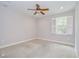Bedroom featuring neutral paint, carpet flooring, plantation shutters, and a ceiling fan at 3323 Anna George Dr, Valrico, FL 33596