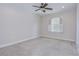 Bedroom featuring neutral paint, carpet flooring, plantation shutters, and a ceiling fan at 3323 Anna George Dr, Valrico, FL 33596