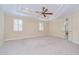 Large bedroom with recessed lighting, custom ceiling and adjacent bath at 3323 Anna George Dr, Valrico, FL 33596