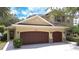 Two-story home featuring a charming exterior with a two-car garage, manicured lawn, and welcoming curb appeal at 3323 Anna George Dr, Valrico, FL 33596