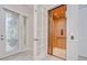 Foyer with glass paneled door and an interior elevator at 3323 Anna George Dr, Valrico, FL 33596