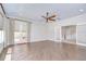 Large living room with hardwood floors, recessed lighting and backyard access at 3323 Anna George Dr, Valrico, FL 33596