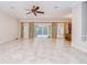 Open living room with sliding glass doors leading to the pool, and connecting to the kitchen at 3323 Anna George Dr, Valrico, FL 33596