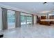Large living room with sliding glass doors to the pool and open to the kitchen at 3323 Anna George Dr, Valrico, FL 33596