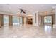 Expansive living area with sliding glass doors to the outdoor, showcasing open kitchen and layout at 3323 Anna George Dr, Valrico, FL 33596