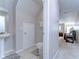 Cozy half bathroom with a pedestal sink and easy access from the living room at 3456 Castle Stone Ct, Valrico, FL 33594