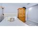 Comfortable bedroom with a bed, decorative pillows, and an armoire for storage, providing a relaxing space at 3456 Castle Stone Ct, Valrico, FL 33594