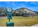 Exterior view of townhome community with a pet waste station, offering a convenient and clean environment at 3456 Castle Stone Ct, Valrico, FL 33594