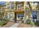 Inviting townhome features a covered porch, well-maintained landscaping, and a freshly painted facade at 3456 Castle Stone Ct, Valrico, FL 33594