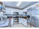 Modern kitchen features stainless steel appliances, granite countertops, and tile backsplash at 3456 Castle Stone Ct, Valrico, FL 33594