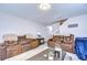 Inviting living area boasts comfortable seating, a staircase, and stylish decor elements at 3456 Castle Stone Ct, Valrico, FL 33594