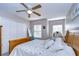Bright main bedroom features a ceiling fan, closet, and windows allowing for lots of natural light at 3456 Castle Stone Ct, Valrico, FL 33594
