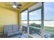 Relaxing screened patio area featuring a comfortable bench, perfect for enjoying the outdoors at 3456 Castle Stone Ct, Valrico, FL 33594