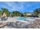 Large community pool with lounge seating offering residents ample space for leisure and relaxation at 3456 Castle Stone Ct, Valrico, FL 33594