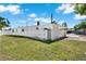 Backyard features a shed, privacy fence, and well-manicured lawn at 3501 63Rd N St, St Petersburg, FL 33710