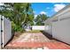 Backyard features a shed, privacy fence, and brick pavers at 3501 63Rd N St, St Petersburg, FL 33710