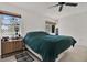 Bright bedroom features two windows, closet and wooden cabinet at 3501 63Rd N St, St Petersburg, FL 33710