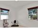 Bright bedroom features neutral tile flooring, ample natural light, and automatic cat box at 3501 63Rd N St, St Petersburg, FL 33710