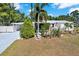 Quaint single-Gathering home with mature landscaping, including palm trees and manicured shrubs at 3501 63Rd N St, St Petersburg, FL 33710