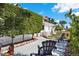 Relaxing front yard with a charming patio area and inviting seating at 3501 63Rd N St, St Petersburg, FL 33710