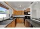 Bright kitchen featuring wood cabinets, modern appliances, and a window over the sink at 3501 63Rd N St, St Petersburg, FL 33710