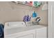 Convenient laundry room features a washer and dryer with storage shelves at 3501 63Rd N St, St Petersburg, FL 33710
