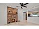 Cozy living room featuring a brick fireplace and tile flooring at 3501 63Rd N St, St Petersburg, FL 33710