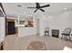 Open-concept living area with tile flooring and a glimpse of the kitchen at 3501 63Rd N St, St Petersburg, FL 33710