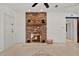 Spacious living area with a fireplace, tile flooring, and access to other rooms at 3501 63Rd N St, St Petersburg, FL 33710