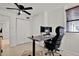 Bright home office features tiled floors, modern desk and a view to outside at 3501 63Rd N St, St Petersburg, FL 33710