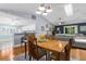 Dining room leading to the living area and kitchen showcasing the home's open and airy design at 3668 Pond View Ln, Sarasota, FL 34235