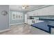 Well lit kitchen featuring tiled floors, ample white cabinetry and blue countertops at 3668 Pond View Ln, Sarasota, FL 34235