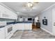 Kitchen boasts white appliances, blue countertops, and tiled floors at 3668 Pond View Ln, Sarasota, FL 34235