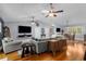 An expansive open-plan living room with hardwood floors flows into the dining area and kitchen at 3668 Pond View Ln, Sarasota, FL 34235