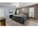 Cozy main bedroom featuring a neutral color palette, artwork, and lots of natural light at 3668 Pond View Ln, Sarasota, FL 34235