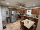 Eat-in kitchen featuring stainless steel appliances, granite countertops, and wood cabinets at 37401 Teaberry Loop, Zephyrhills, FL 33542