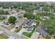 View of a modern two-story home with a well-maintained lawn and a detached deck at 3817 W San Nicholas St, Tampa, FL 33629