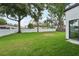 Expansive backyard features mature trees and white vinyl fencing at 3817 W San Nicholas St, Tampa, FL 33629
