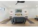 This bedroom has hardwood floors, stylish decor, and natural light at 3817 W San Nicholas St, Tampa, FL 33629