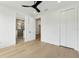 Bright bedroom featuring a modern ceiling fan and ensuite bathroom at 3817 W San Nicholas St, Tampa, FL 33629