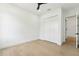 Bedroom with light wood floors and double door closet at 3817 W San Nicholas St, Tampa, FL 33629