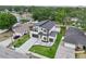Striking new construction featuring a modern design, complemented by a well-manicured lawn and two-car garage at 3817 W San Nicholas St, Tampa, FL 33629