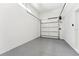 A clean garage with epoxy floors and a new garage door at 3817 W San Nicholas St, Tampa, FL 33629