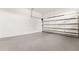 A clean garage with epoxy floors and a new garage door at 3817 W San Nicholas St, Tampa, FL 33629